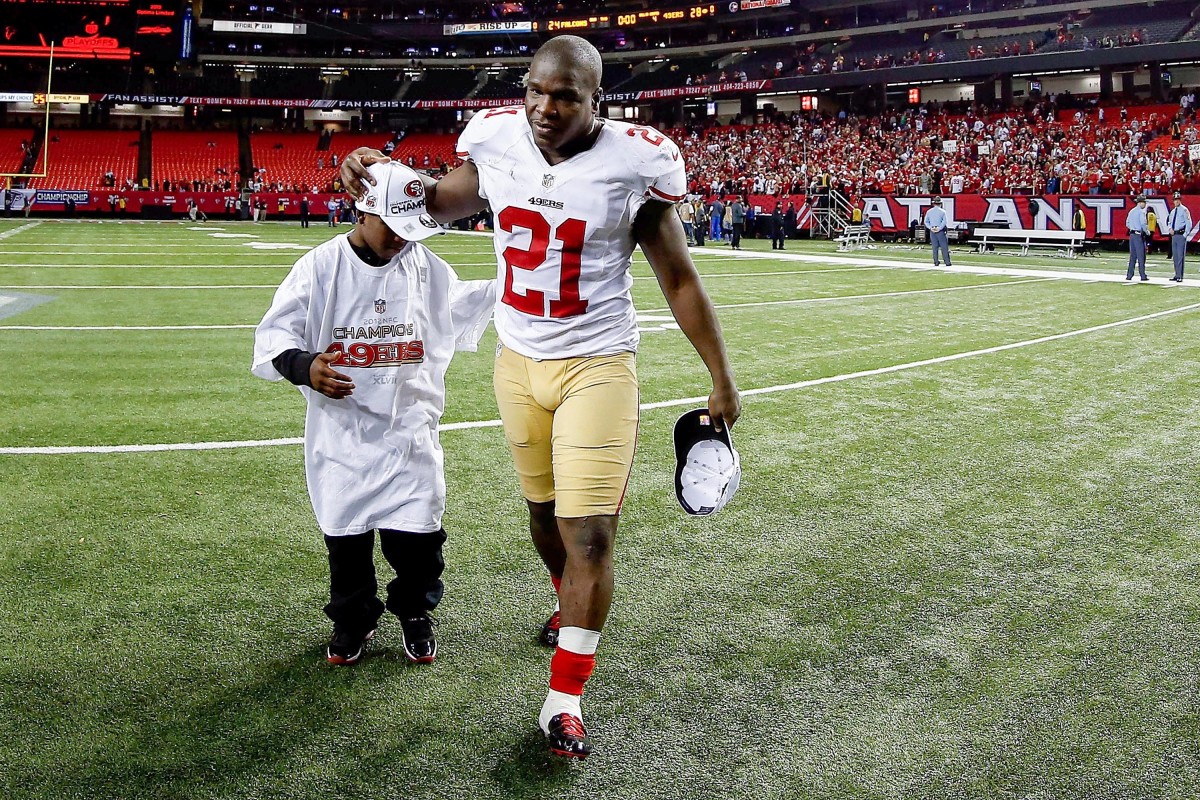 Gore Sr. and Gore Jr. in 2013 after the 49ers won the NFC championship game.